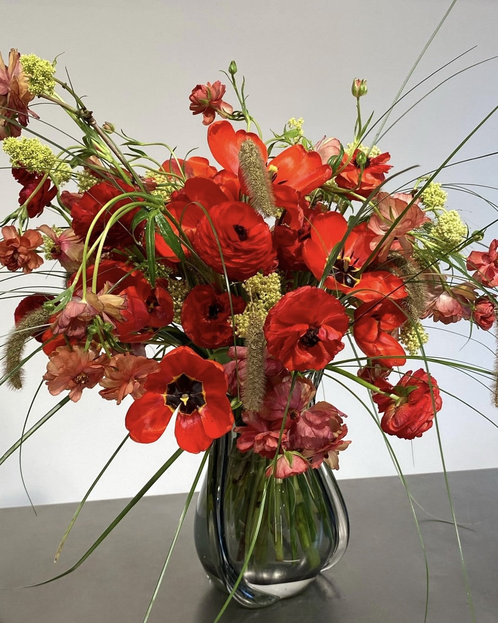 High-end floral arrangements Seattle – bright red-toned bouquet by Modern Nature