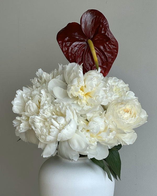 Lush seasonal peony bouquet designed in Seattle floral studio